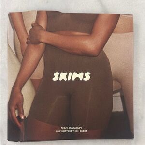 SKIMS Sculpting Mid-Thigh Shorts in Brown